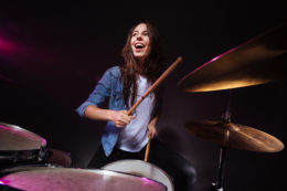 Woman playing the drums